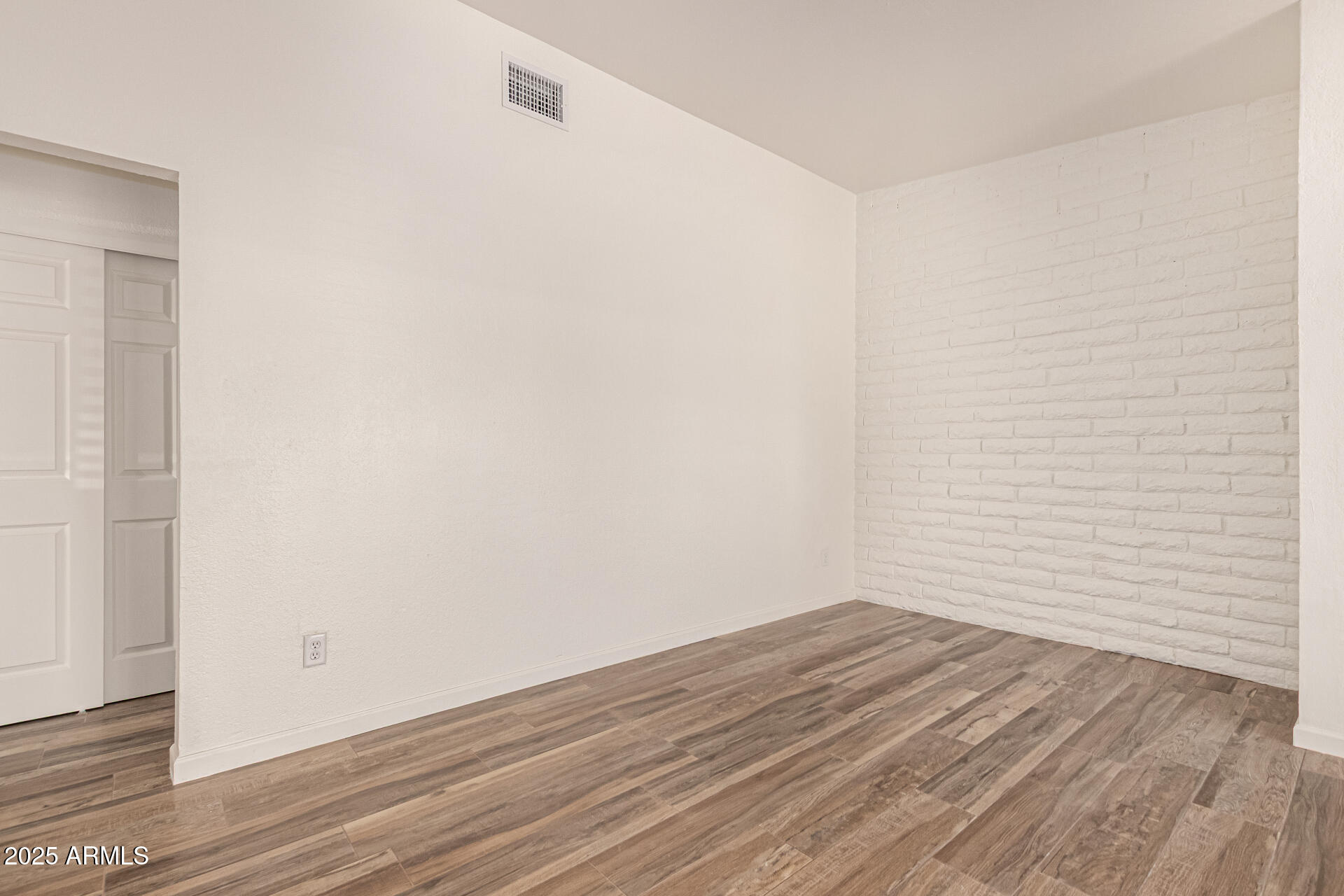 5946 West Rose Lane, Unit C Glendale, AZ 85301 - Photo 9 of 19 a view of small space with wooden floor