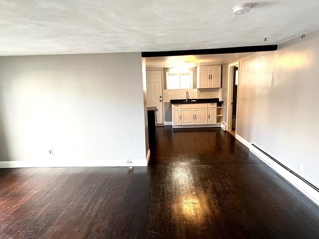 150 Locust Street, Unit 1 Winthrop, MA 02152 - Photo 7 of 11 a view of a room with wooden floor