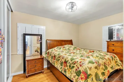 a bedroom with a bed and dresser