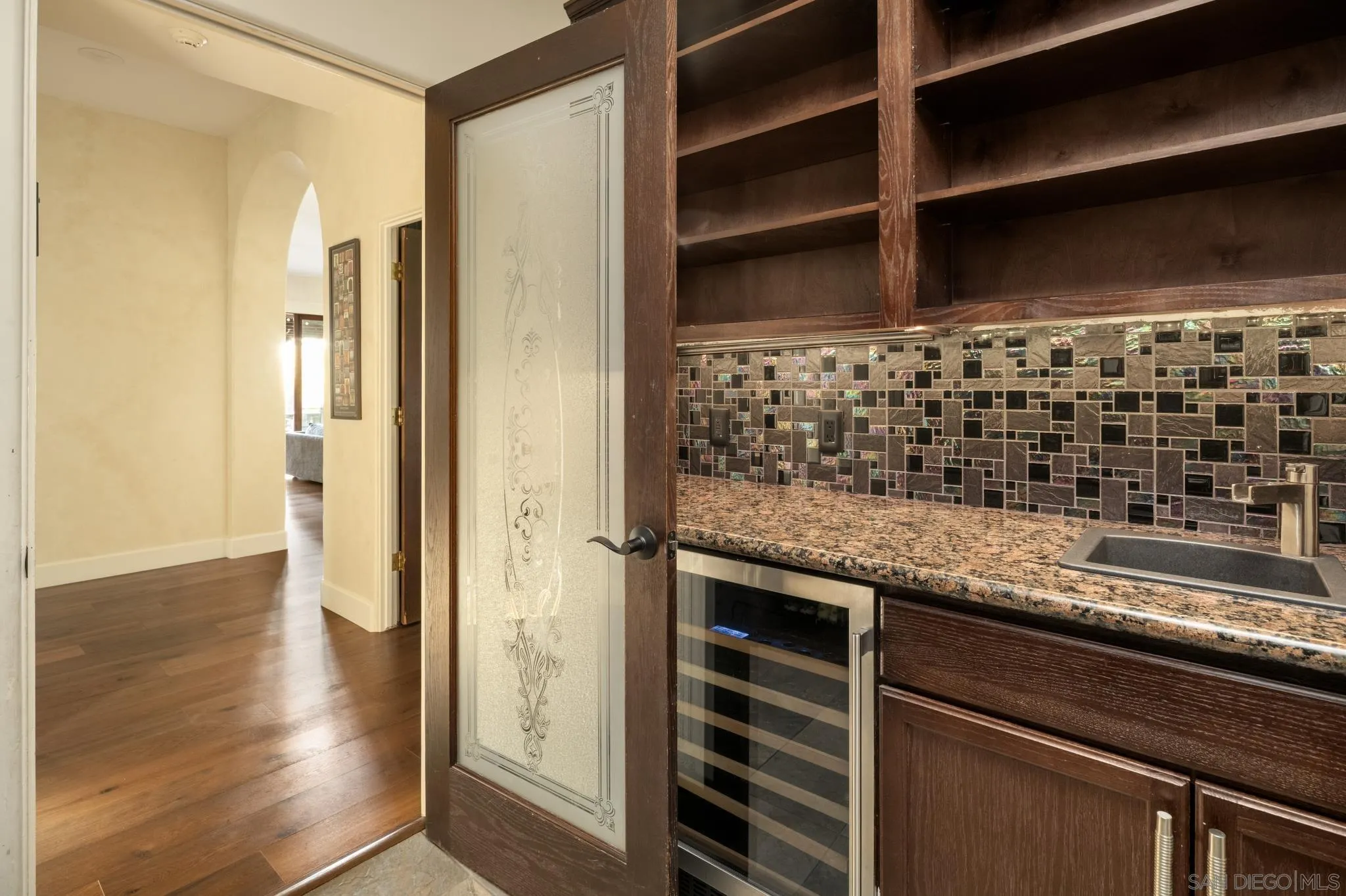 3028 Paseo Cielo Rancho Santa Fe, CA 92024 - Photo 29 of 50 a kitchen with granite countertop a sink and a refrigerator