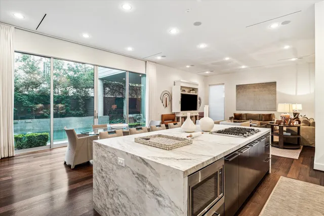 a kitchen with a stove sink and microwave