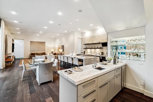 a open kitchen with stainless steel appliances kitchen island sink stove and cabinets