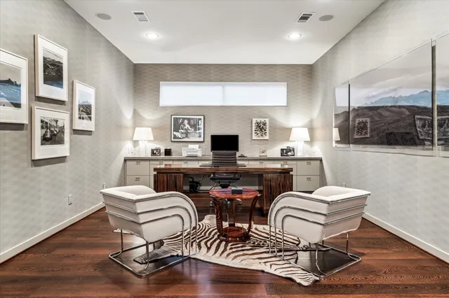 a kitchen with a dining table chairs and a fireplace