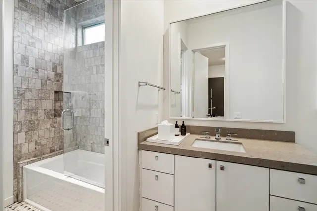 a bathroom with a bathtub and a sink
