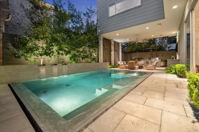 a view of a swimming pool with a patio