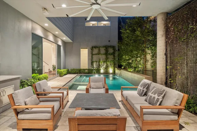 a living room with furniture and a chandelier