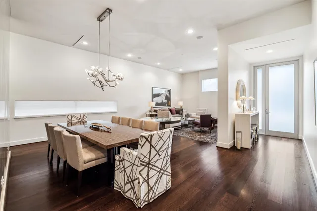 a view of a dining room with furniture wooden floor and chandelier