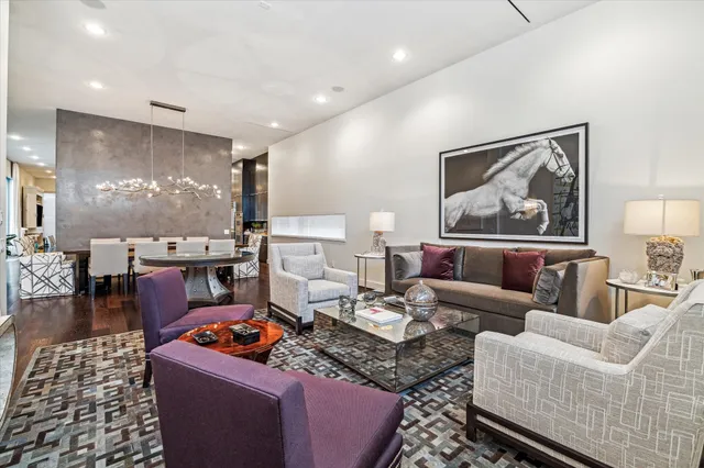 a living room with furniture and a painting