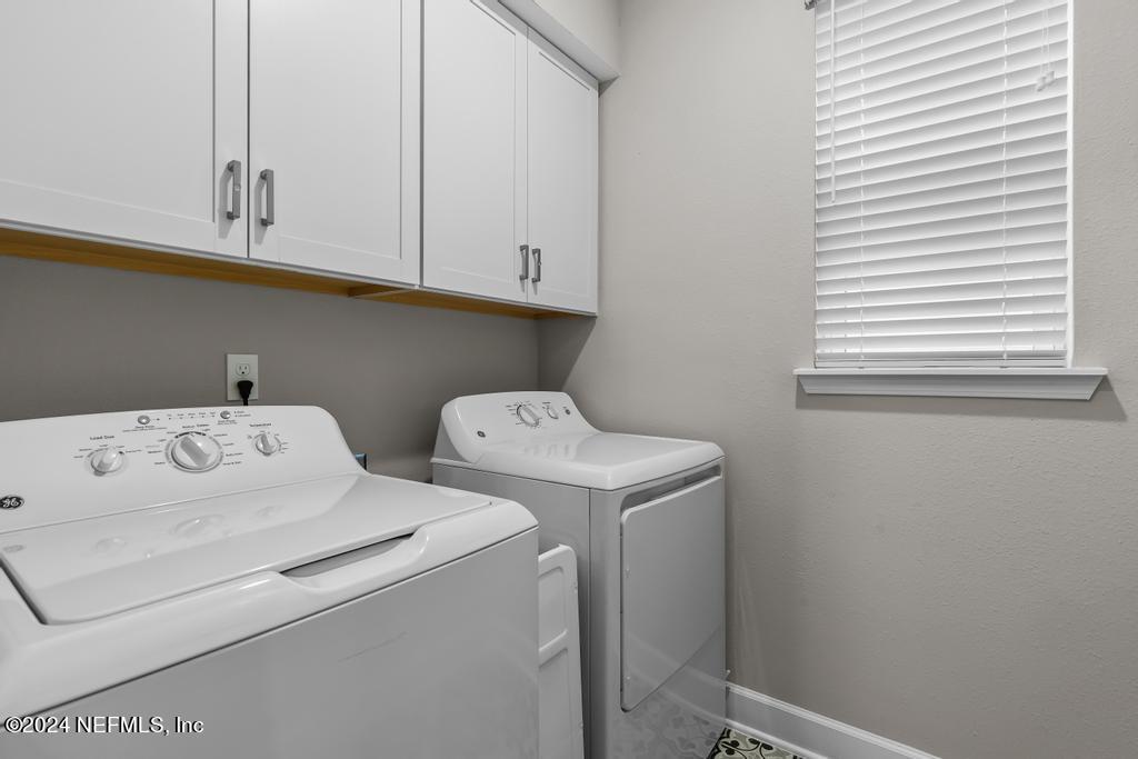 11232 Bright Path Jacksonville, FL 32256 - Photo 22 of 78 a utility room with dryer and washer