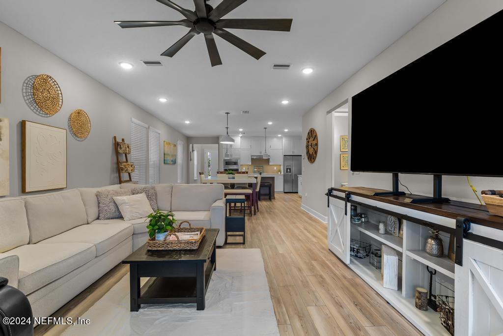 11232 Bright Path Jacksonville, FL 32256 - Photo 24 of 78 a living room with furniture and a flat screen tv