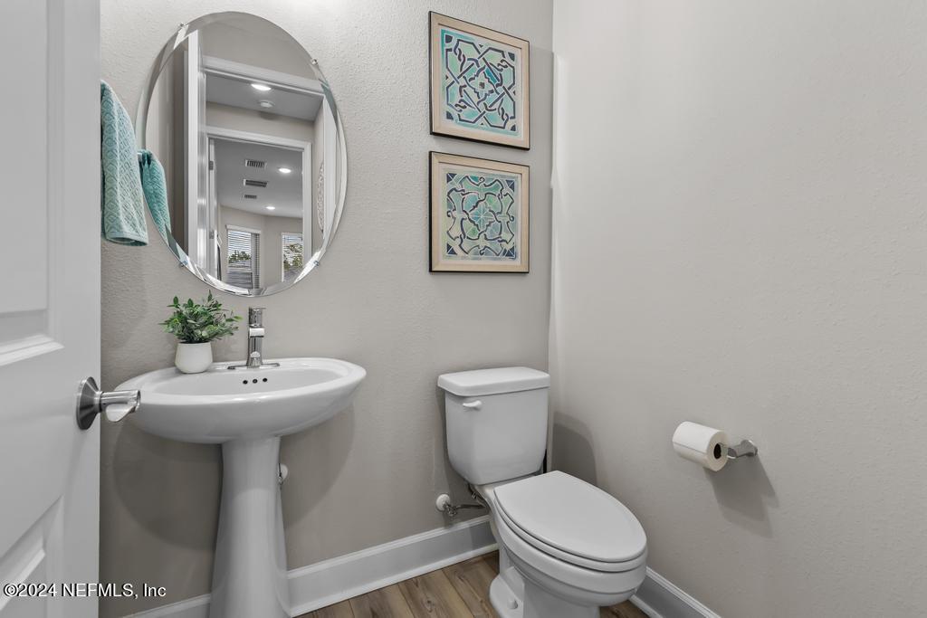 11232 Bright Path Jacksonville, FL 32256 - Photo 25 of 78 a bathroom with a toilet sink and mirror