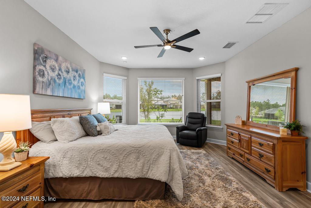 11232 Bright Path Jacksonville, FL 32256 - Photo 30 of 78 a living room with a bed furniture and a large window