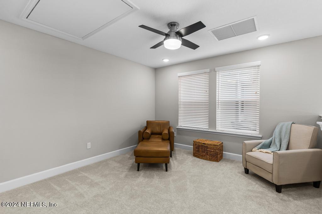 11232 Bright Path Jacksonville, FL 32256 - Photo 39 of 78 a living room with furniture and a window