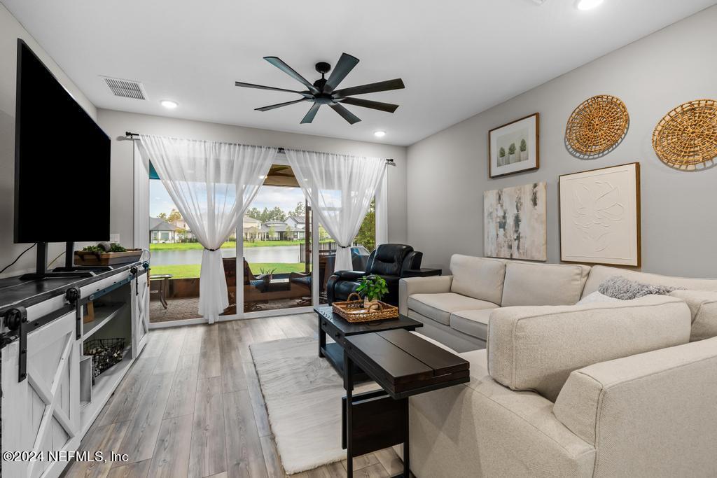 11232 Bright Path Jacksonville, FL 32256 - Photo 4 of 78 a living room with furniture and a flat screen tv