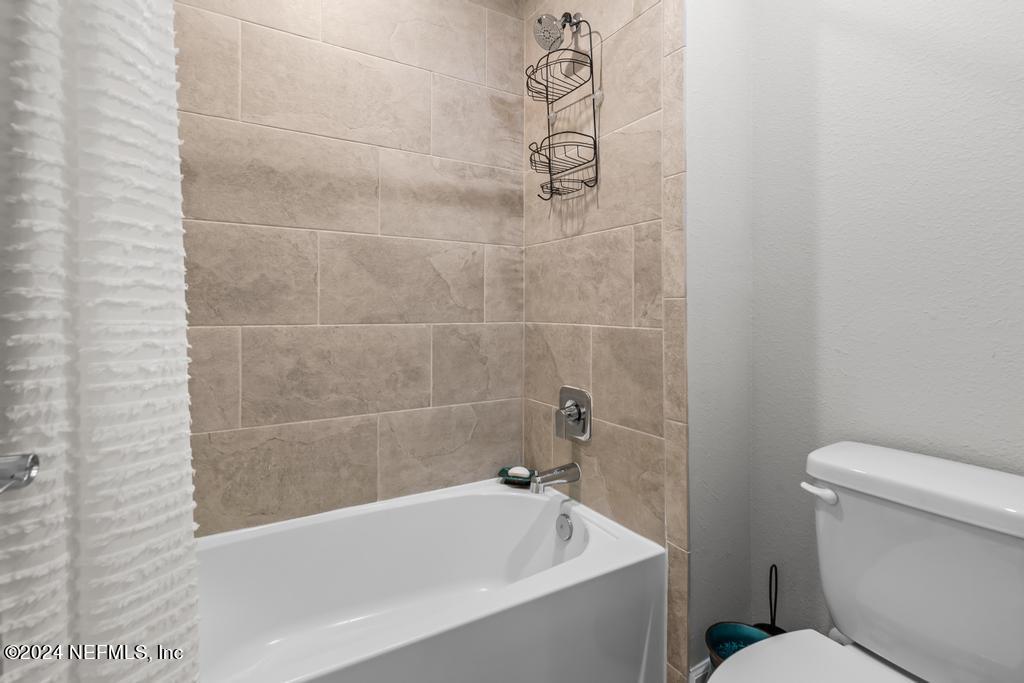 11232 Bright Path Jacksonville, FL 32256 - Photo 49 of 78 a white bath tub sitting next to a white toilet