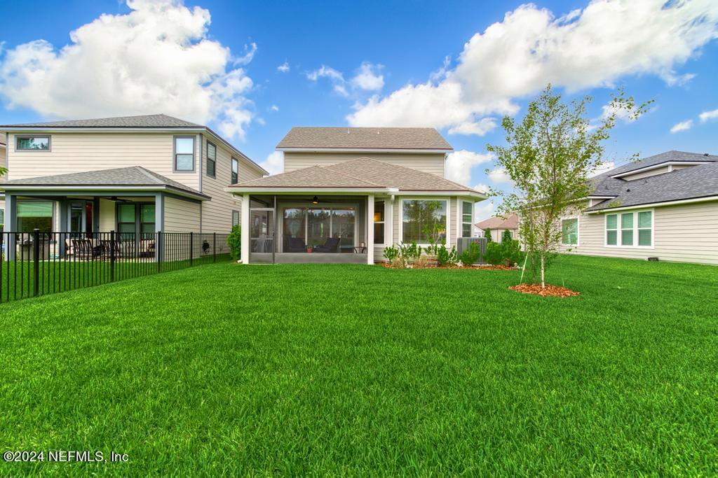 11232 Bright Path Jacksonville, FL 32256 - Photo 55 of 78 a front view of a house with a yard table and chairs