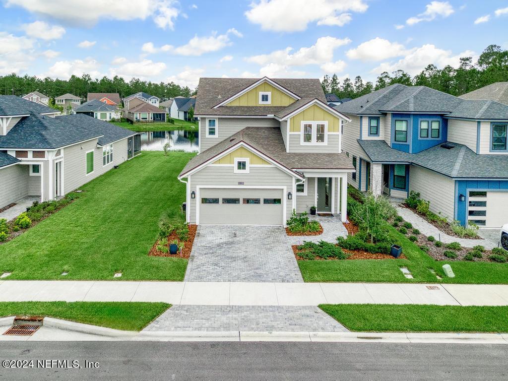 11232 Bright Path Jacksonville, FL 32256 - Photo 59 of 78 a view of a big house with a big yard and large trees