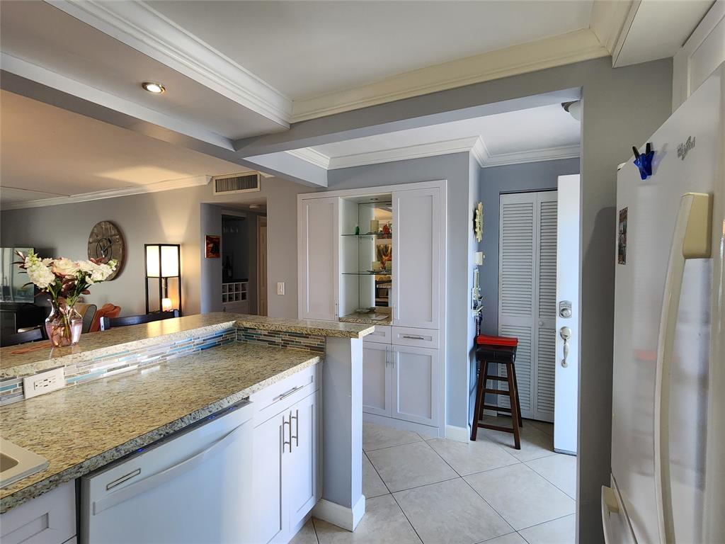 321 Southeast 3rd Street, Unit 302 Dania Beach, FL 33004 - Photo 6 of 23 Kitchen with built ins