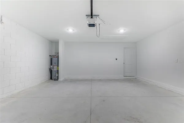 a kitchen with cabinets and steel appliances