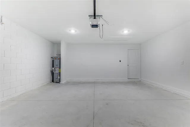 a kitchen with cabinets and steel appliances