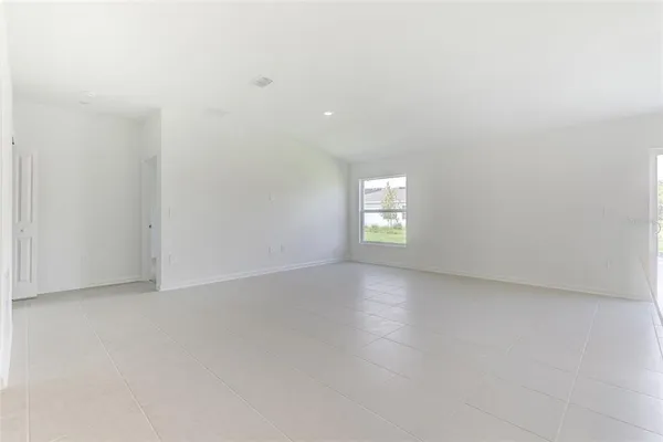 a view of a glass door and a yard