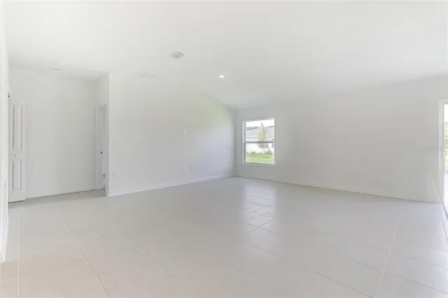 a view of a glass door and a yard