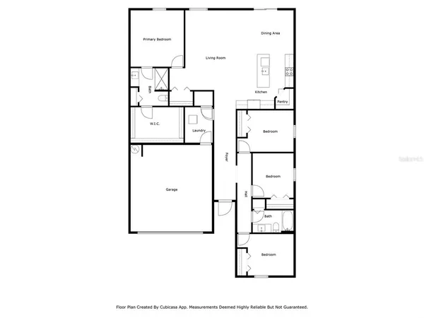 an aerial view of multiple houses with a yard