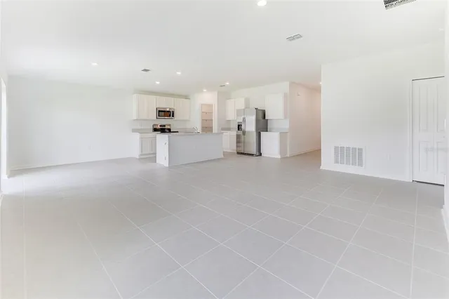 a view of a livingroom with kitchen