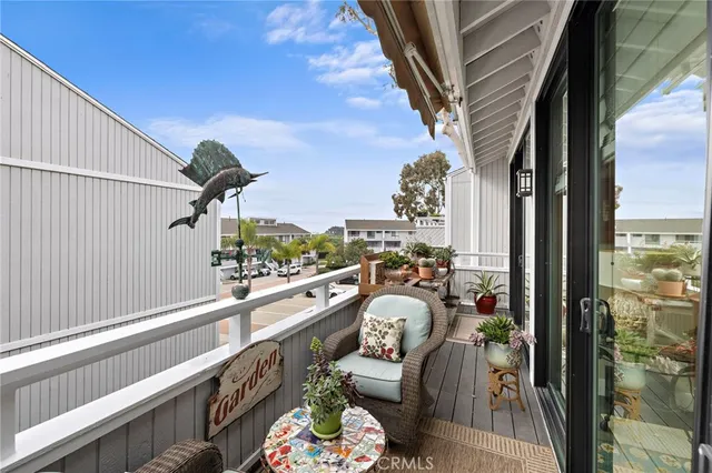 a city view from a balcony with furniture