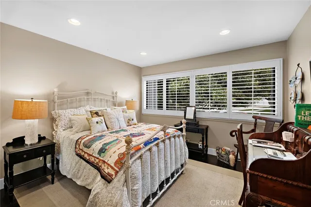 a bedroom with a bed and a table