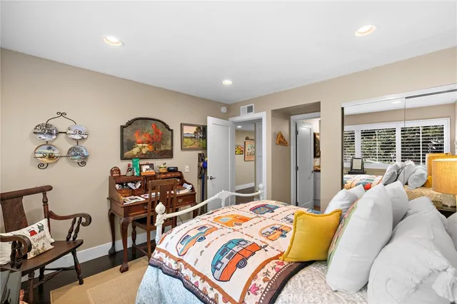 a bedroom with furniture and a window