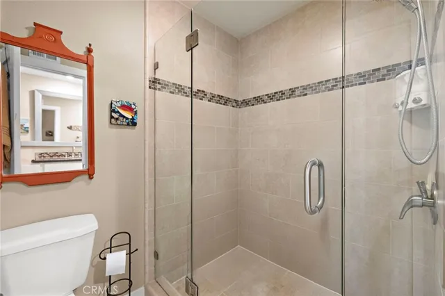 a bathroom that has a shower toilet and sink