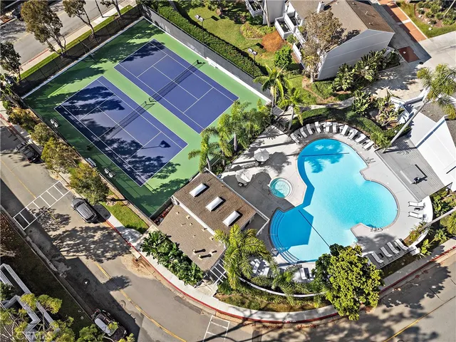an aerial view of a swimming pool patio and outdoor seating