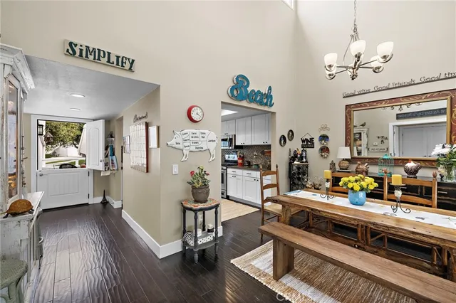 a bedroom with furniture and a wooden floor
