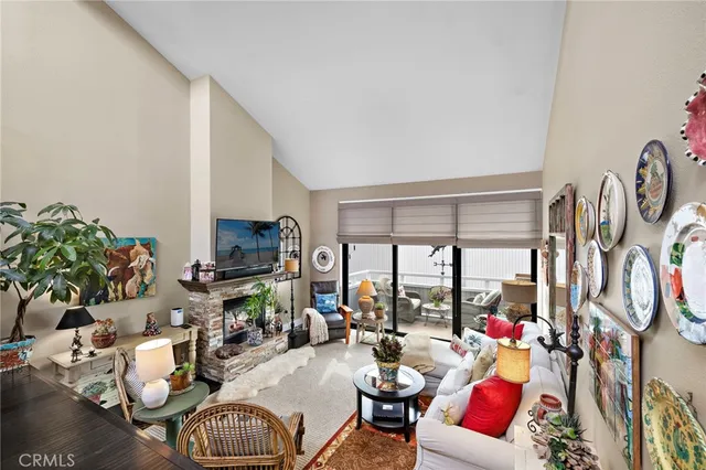 a living room with furniture fireplace and a flat screen tv