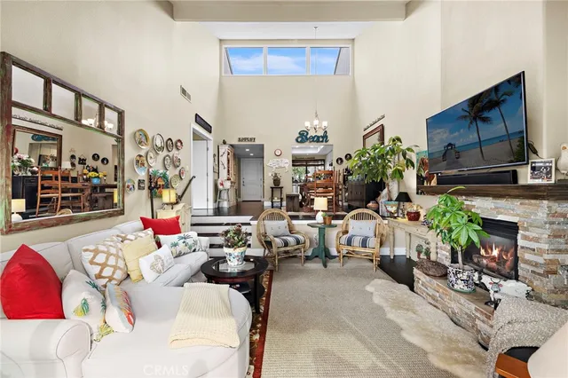 a living room with patio furniture and a fireplace