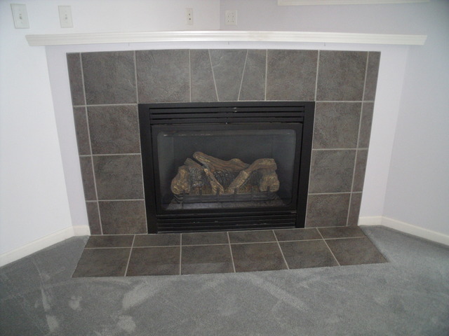 2123 Autumn Lane, Unit 2123 DeKalb, IL 60115 - Photo 3 of 12 a room with a fireplace