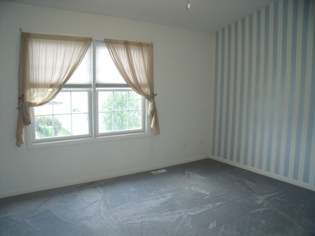 2123 Autumn Lane, Unit 2123 DeKalb, IL 60115 - Photo 8 of 12 an empty room with a window