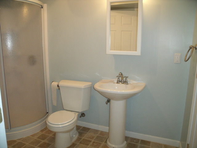 2123 Autumn Lane, Unit 2123 DeKalb, IL 60115 - Photo 10 of 12 a bathroom with a sink toilet and a mirror