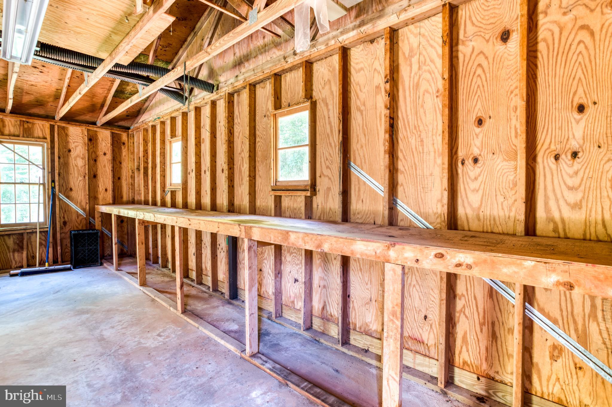 803 Weaver Hollow Road Banco, VA 22711 - Photo 36 of 67 a view of a porch with wooden floor and furniture