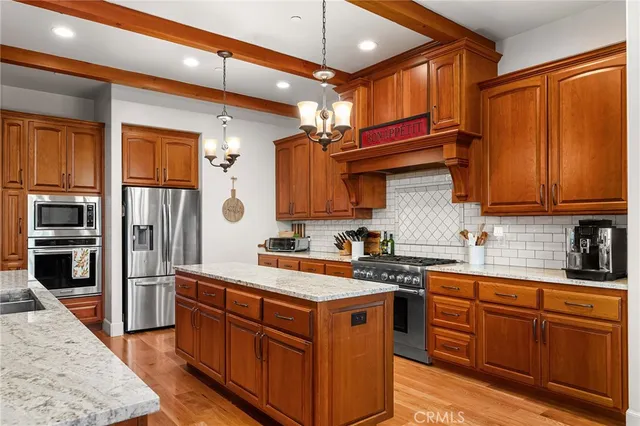 a large kitchen with a table and chairs