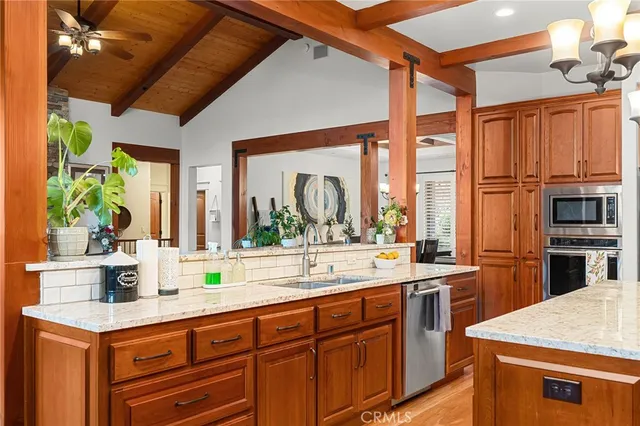 a bedroom with a bed couch and a large window