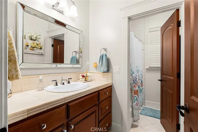 a kitchen with stainless steel appliances granite countertop a stove a microwave a sink and cabinets