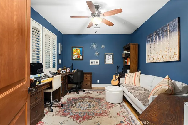 a bedroom with furniture and a lamp