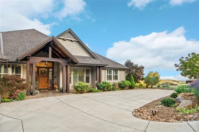 a view of entryway with wooden floor and front door