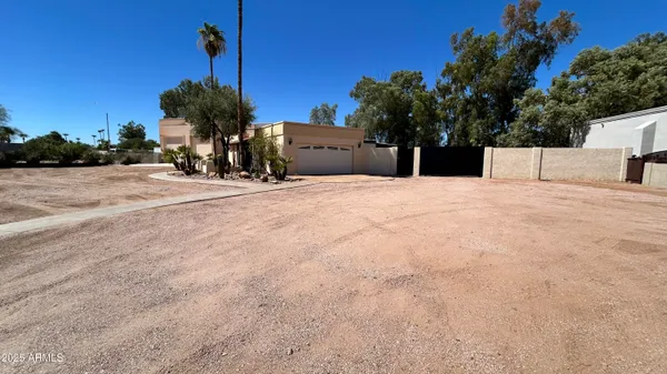 a front view of a house with a yard and a garage