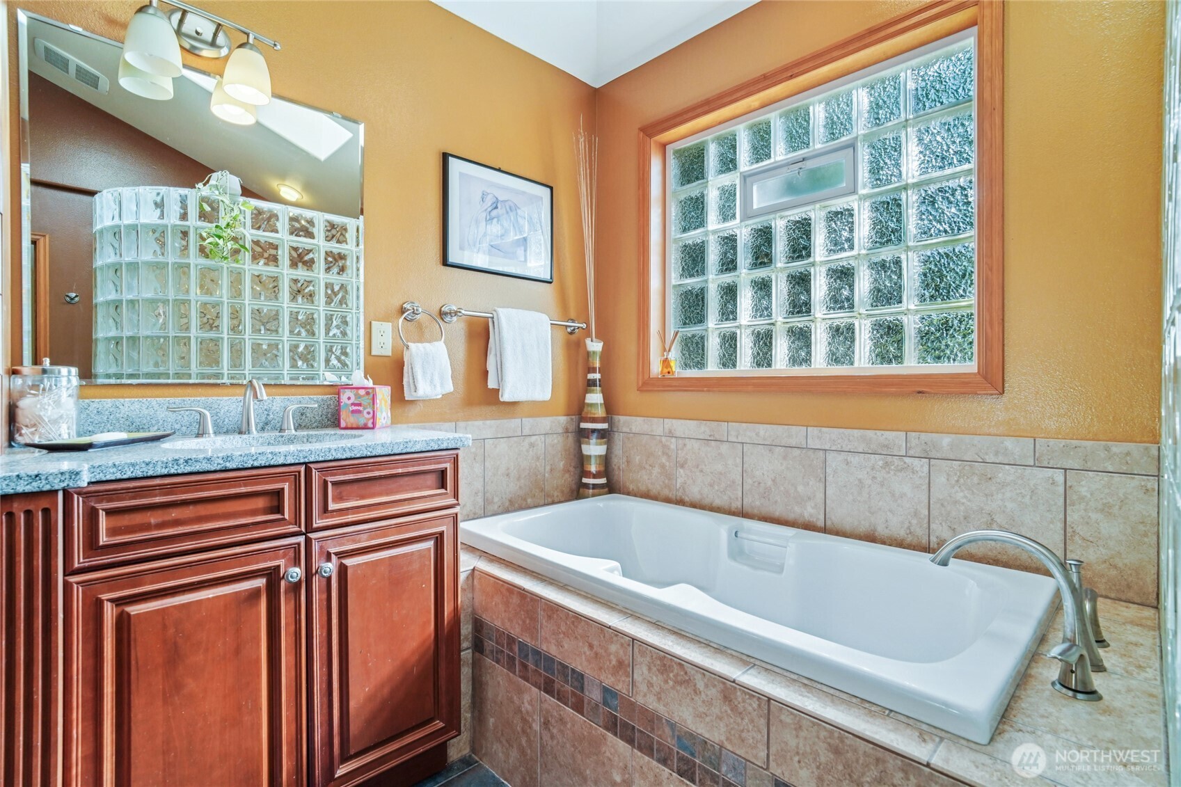 14827 Three Lakes Road Snohomish, WA 98290 - Photo 13 of 39 a bathroom with a tub sink and next to a window