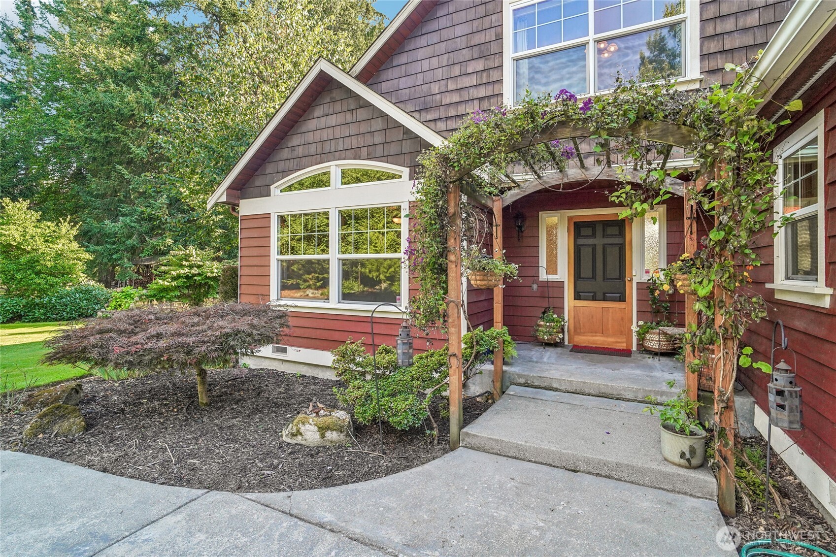 14827 Three Lakes Road Snohomish, WA 98290 - Photo 3 of 39 a front view of a house with garden