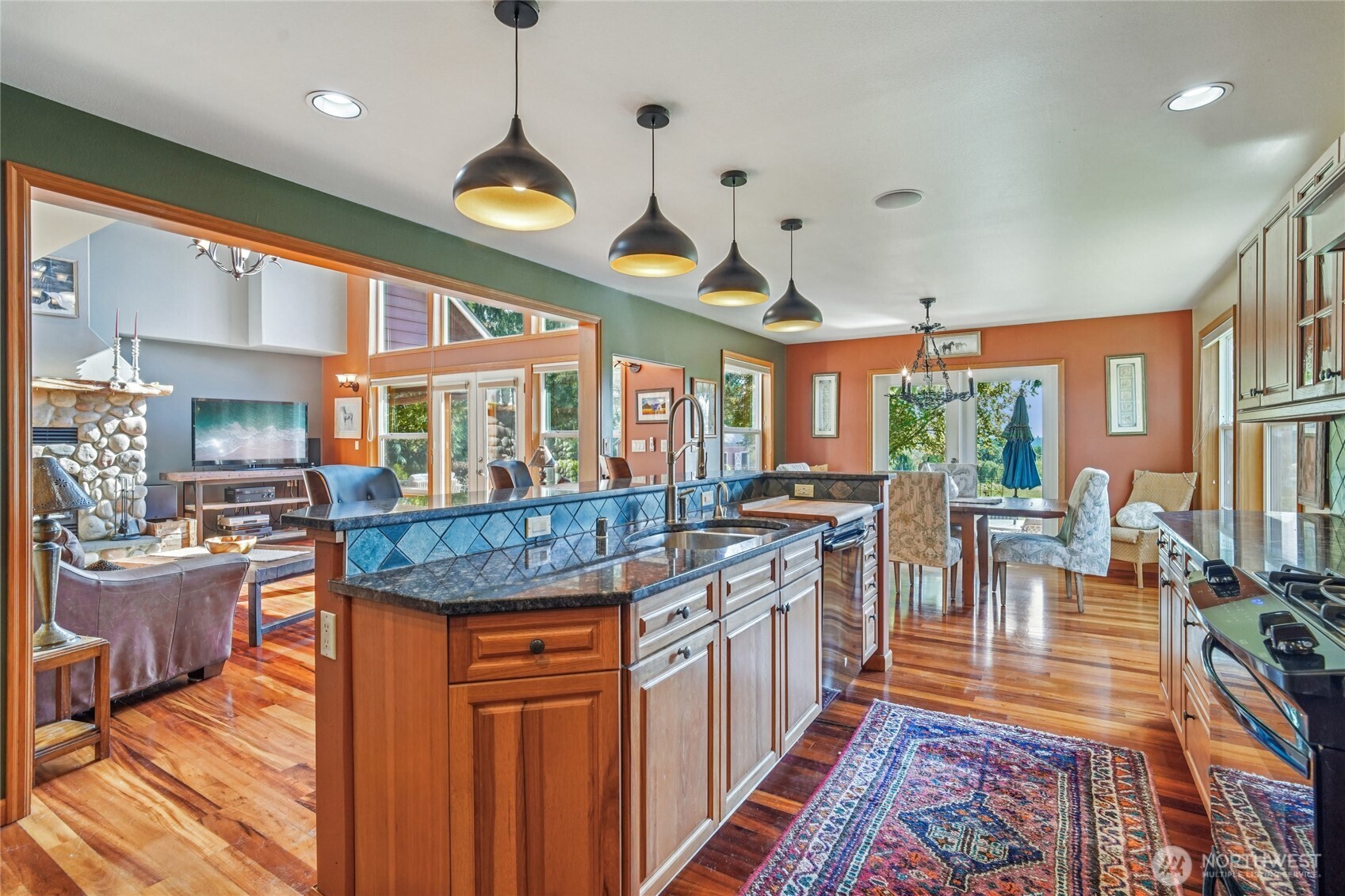 14827 Three Lakes Road Snohomish, WA 98290 - Photo 7 of 39 a kitchen with stainless steel appliances granite countertop a dining table and chairs in it