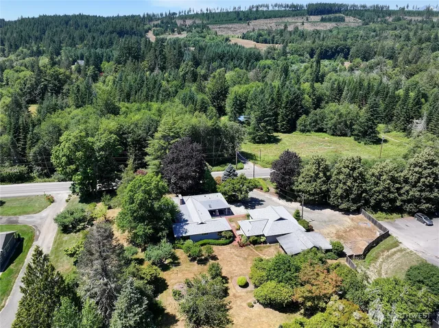 an aerial view of a house with mountain view